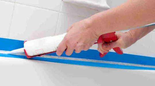 caulking bathroom tile