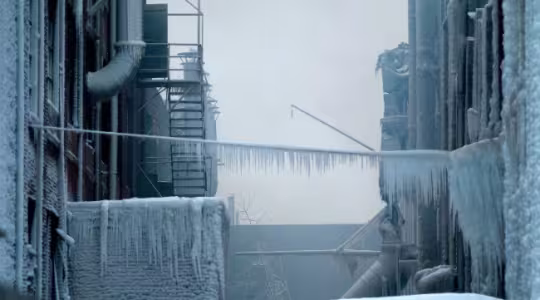 Commercial building frozen over due to snow load dangers