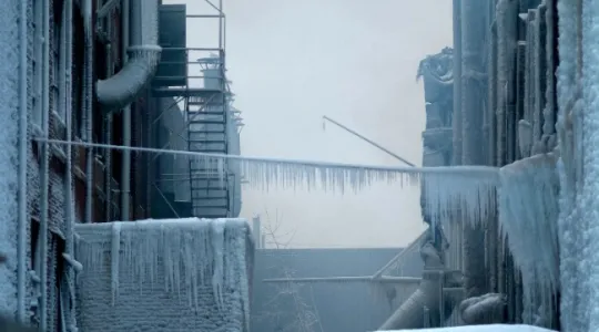 Commercial building frozen over due to snow load dangers
