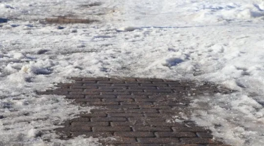 Snow on sidewalk