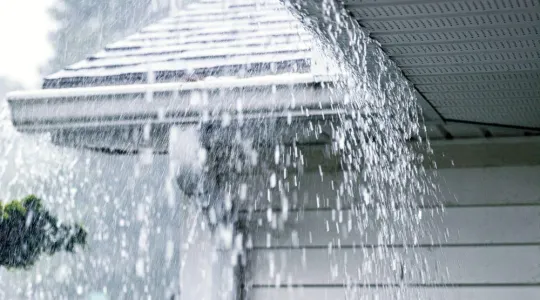 Water overflowing from gutter due to excessive rain