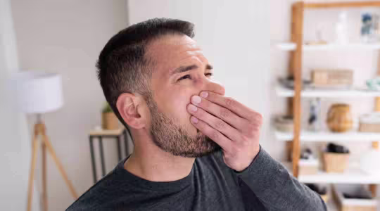 man smelling a bad odor in Metairie home
