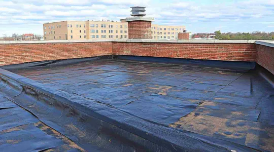 water damage on flat commercial roof